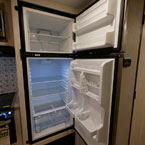 Stainless Steel Refrigerator Shown Open. 
