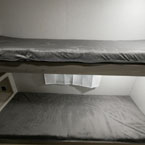 Two 26 Inch by 74 Inch Bunks with Teddy Grey Bunk Mats.
